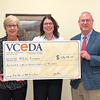 MECC President Kristen Westover and Vice President of Institutional Advancement Amy Greear receive the funds from VCEDA Executive Director/General Counsel Jonathan Belcher.  PROVIDED BY VCEDA