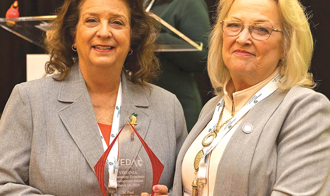 The revitalization of St. Paul’s Lyric Theater won a Virginia Economic Developers Association community economic development award last week during the association’s annual spring conference in Charlottesville. Kathy Stewart of St. Paul Tomorrow, left, receives the award from VEDA President Linda Green. The association said the Lyric project was innovative in its mix of grant funds and donations and its ripple effect on attracting new downtown businesses.  VEDA PHOTO