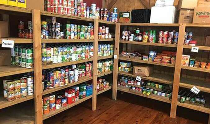 Stocked shelves provided by a generous community and its school.